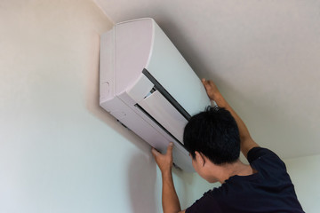 Technician you are checking air conditioning in white room