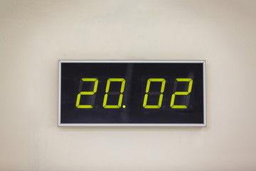 Black digital clock on a white background showing time 20.02 minutes