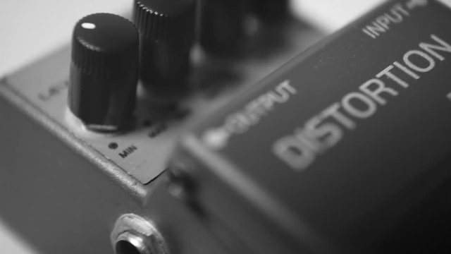 Distortion guitar effects pedal preamp stomp box, close up macro shot