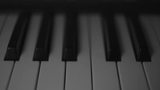Dream of pursuing music, reveal shot of a musical piano keyboard