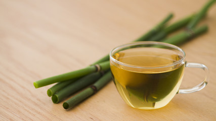 Glass of tea with bamboo