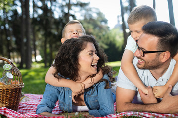 Cheerful happy family picnicking on a beautiful day