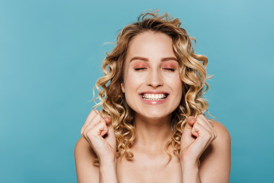 Beauty image of happy half-naked woman smiling and rejoicing with eyes closed