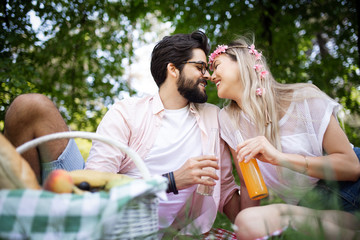 Couple in love enjoying picnic time outdoors