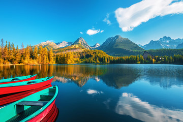 Obraz premium Sunrise view in High Tatras mountains national park and Strbske pleso (Strbske lake) beautiful mountain lake in Slovakia