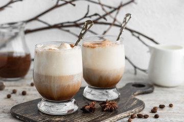 Cold iced coffee with vanilla ice cream and cinnamon