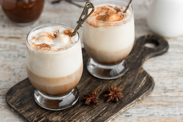 Cold iced coffee with vanilla ice cream and cinnamon