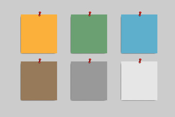 Blank squared notepad pages and pin. Note paper stuck with red pin.