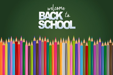 Welcome back to school green chalkboard background with colorful pencils. Realistic vector illustration.