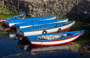 Boats in the water with reflection
