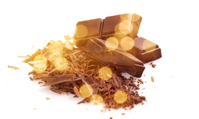 Milk chocolate blocks and pieces isolated on white background