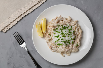 Squid in sour cream sauce. Greek national dish. The view from the top. Copy-space.