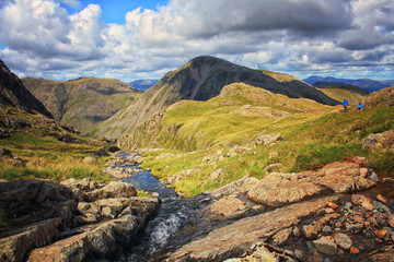 A stunning scenery of the natural beauty of the Lake District with mountains, rivers, lakes and green grass. Cumbria, England, UK. National Park.