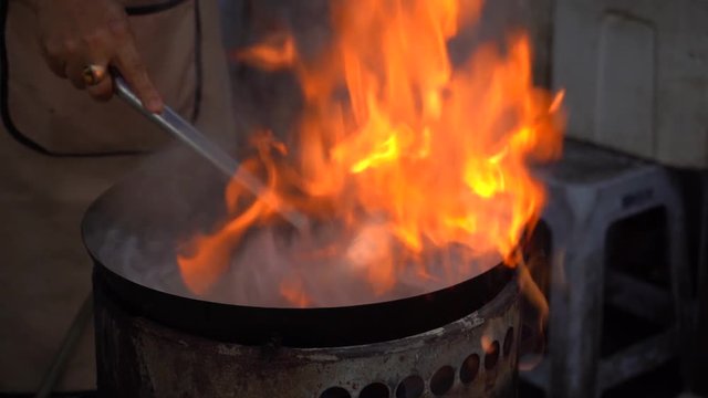 Chinese cooking food slow motion fire
