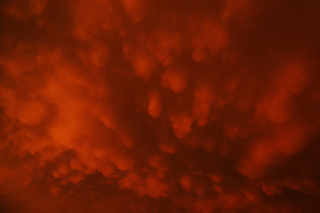 Mammatus clouds forming at sunset ahead of severe thunderstorm