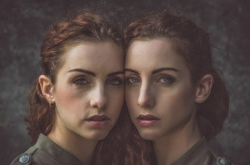 Two twins sisters spending time together - obrazy, fototapety, plakaty