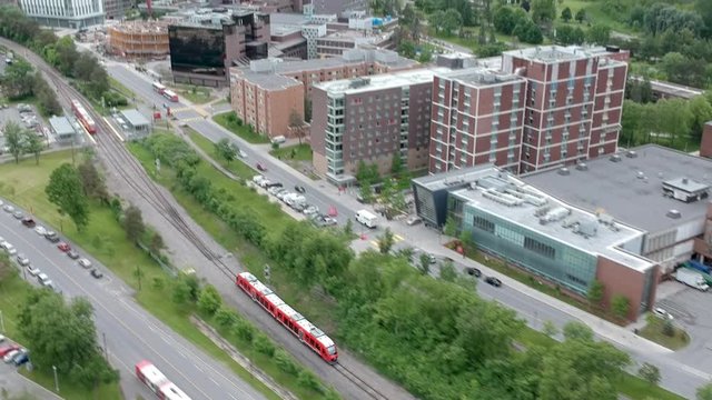 Drone hyperlapse following an Ottawa train on a track through Carelton University.