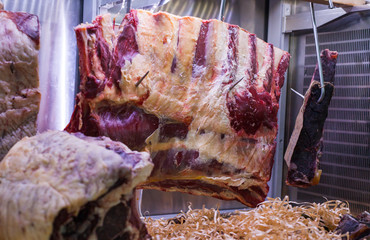 Display of Dry Aged Meat Steaks in butchers shop or restaurant in an display refrigerator.