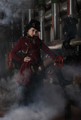 Sexy steampunk woman over industrial background