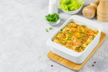Cheese broccoli cabbage casserole, oven baked. Selective focus, space for text.