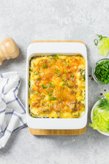 Cheesy chicken cabbage casserole. Top view, space for text.