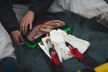 Base jumper packs the parachute before jumping, close-up. Parachute jumps. Base jumping. Parachute...