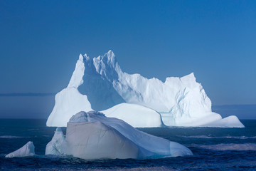 An iceberg along the Newfoundland coastline in summer, very popular with tourist.