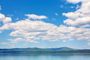 scenic mountain lake with sky and clouds. nature background.