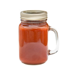 Homemade barbecue sauce in glass jar isolated on white background