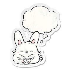 cartoon rabbit and thought bubble as a distressed worn sticker