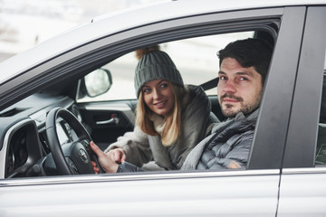 Ready for a journey. Nice couple have weekend at countryside at winter time