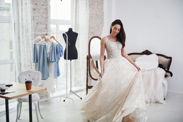 It's so long. The process of fitting the dress in the studio of hand crafted clothes