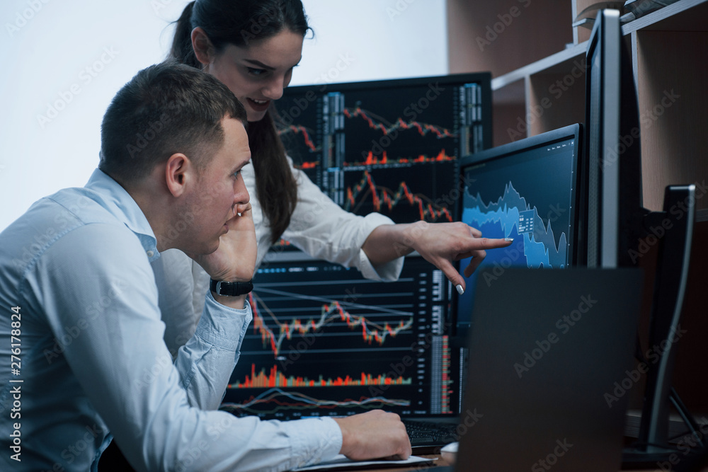 Poster new working day has come. team of stockbrokers are having a conversation in a office with multiple d