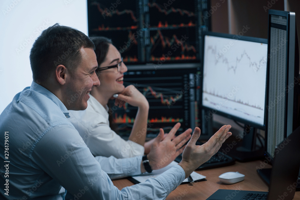 Poster cheerful people have success. team of stockbrokers are having a conversation in a office with multip