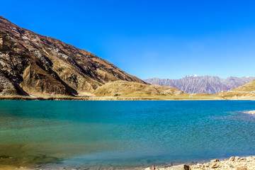 Fototapeta na wymiar Beautiful view of mountainous lake Saiful Muluk in Naran Valley, Mansehra District, Khyber-Pakhtunkhwa, Northern Areas of Pakistan