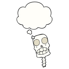 cartoon spooky skull and thought bubble