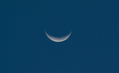 Obraz na płótnie Canvas Crescent moon in blue sky