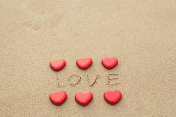Chocolate color Lovely red heart on the beach. Background is a natural in real place, creative Valentine's Day Concept, tropical style background made in Phuket, Thailand.