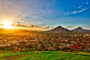 Sunburst at Sunset on Mountains, City