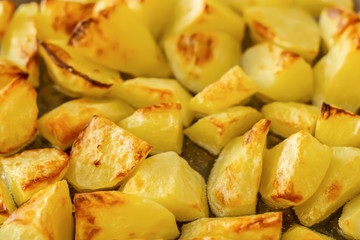 Delicious baked potatoes on glass plate, closeup