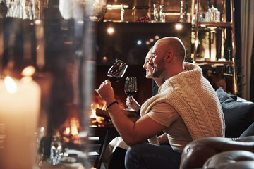 Side view. Girl with her boyfriend have nice evening at beautiful restaurant