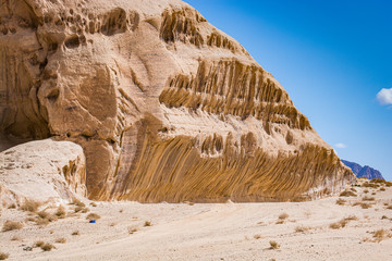 Desert with sandstone and granite rock in shape of boat in Wadi Rum in Jordan