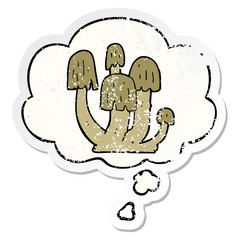 cartoon mushrooms and thought bubble as a distressed worn sticker