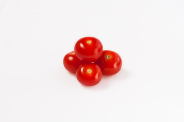 four small red cherry tomatoes
