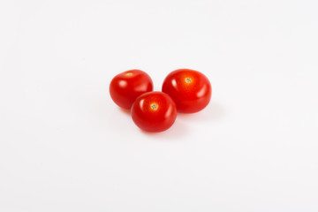 three small red cherry tomatoes