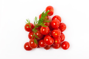 mountain of small red cherry tomatoes with dill