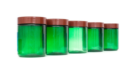 Green plastic jar with a lid on a white background, isolate, tara, Polyethylene terephthalate