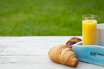 Coffee, orange juice and croissant