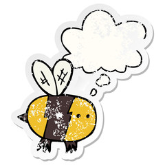 cartoon bee and thought bubble as a distressed worn sticker