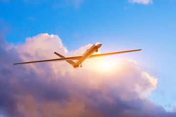 Unmanned military drone on patrol air territory, gaining heights to determine goals.